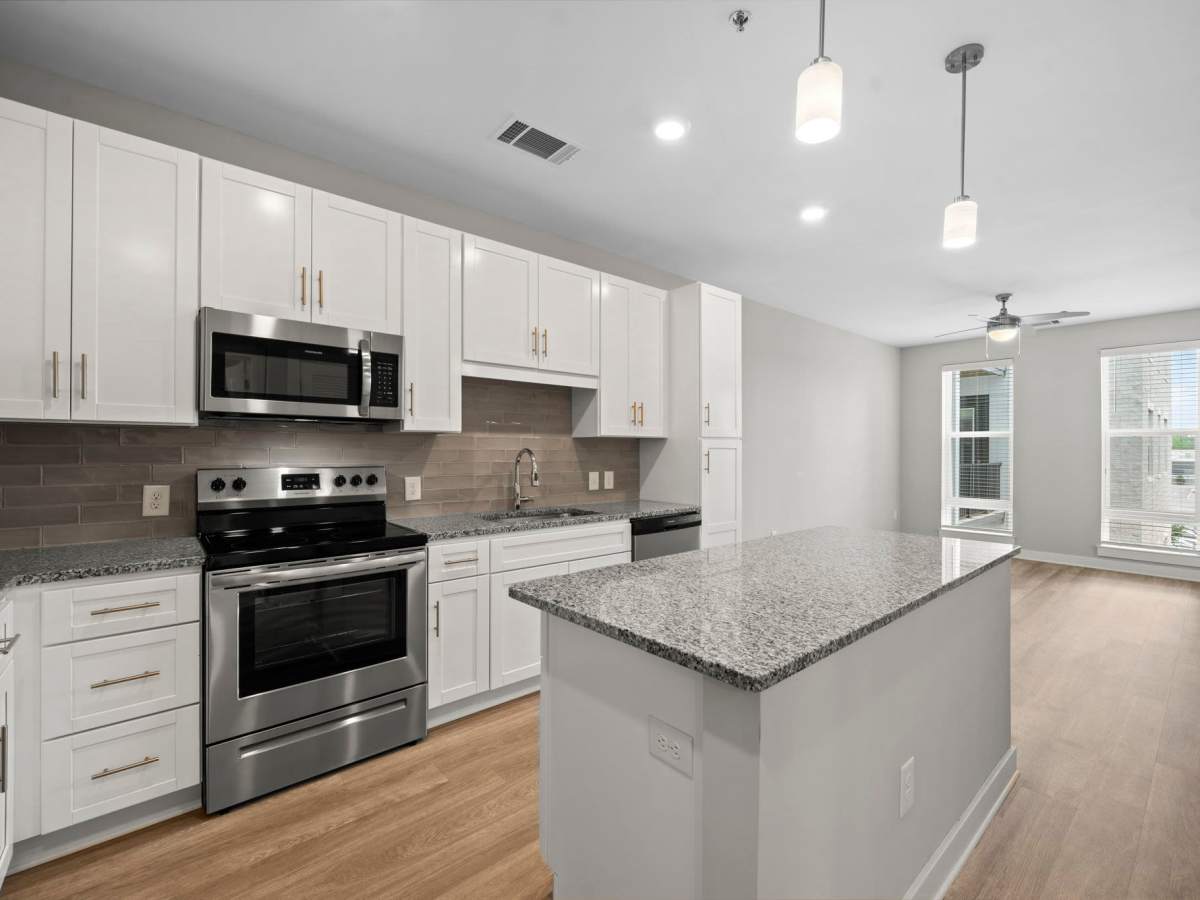Modern kitchen with stainless-steel appliances at The Rise at Regency in Henrico, Virginia
