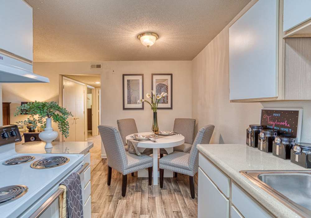 Full-equipped kitchen with vinyl flooring at Treybrooke Village in Greensboro, North Carolina