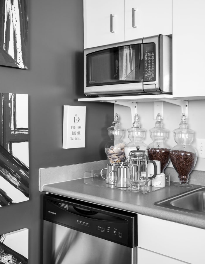 Modern kitchen with stainless-steel appliances at The Gramercy in Manhattan, Kansas