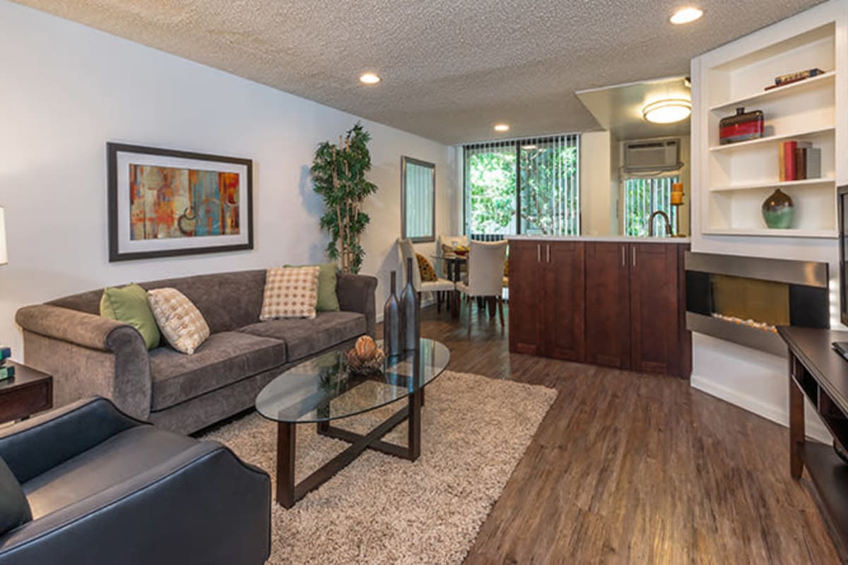 Living room with wood-style floor at Villa Esther, West Hollywood, California