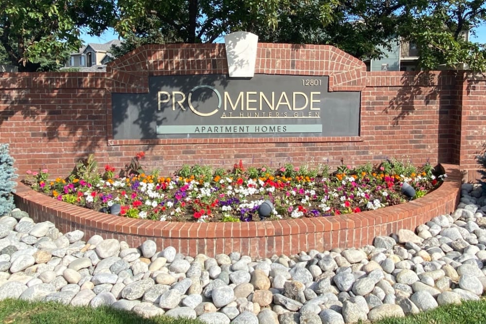 The front monument sign at Promenade at Hunter's Glen Apartments in Thornton, Colorado