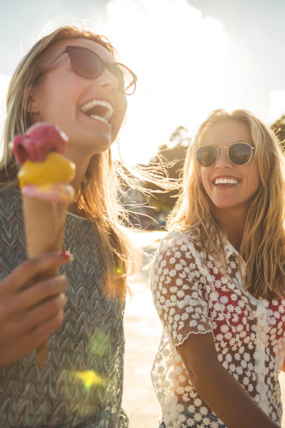 Residents walking and eating ice cream in the community at The Current Apartments in Biloxi, Mississippi