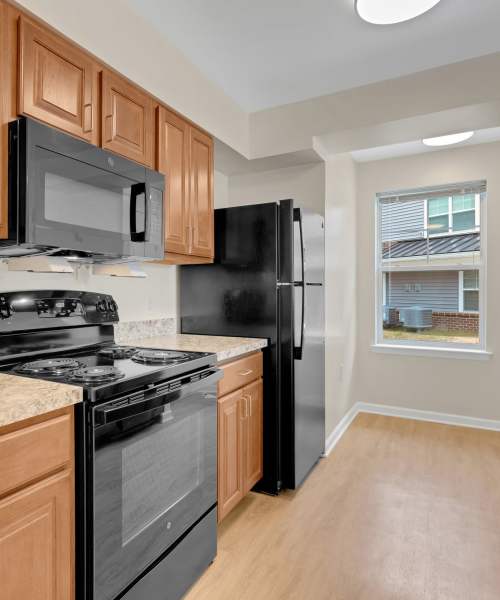 Man making himself some coffee at Robinson Overlook in Columbia, Maryland