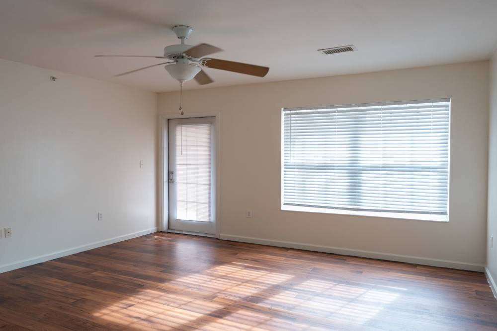 Unfurnished living room with wooden floor at Fairway Breeze in El Reno, Oklahoma