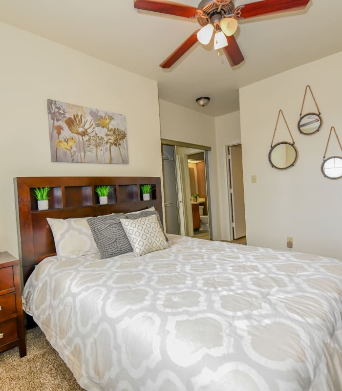 Chic bedroom with ceiling fan at Sheridan Pond in Tulsa, Oklahoma