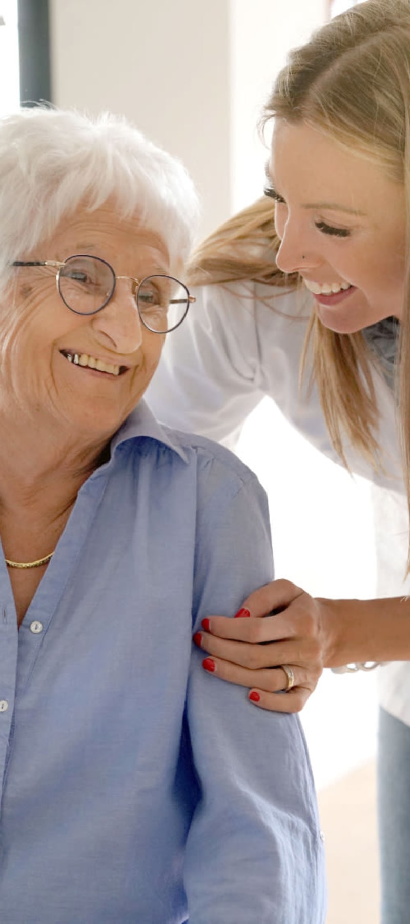 Residents sitting and talking with the help of a caretaker at Edgerton Care Center in Edgerton, Wisconsin