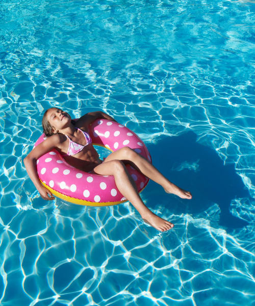 Resident swimming in the pool at Aldingbrooke in West Bloomfield, Michigan