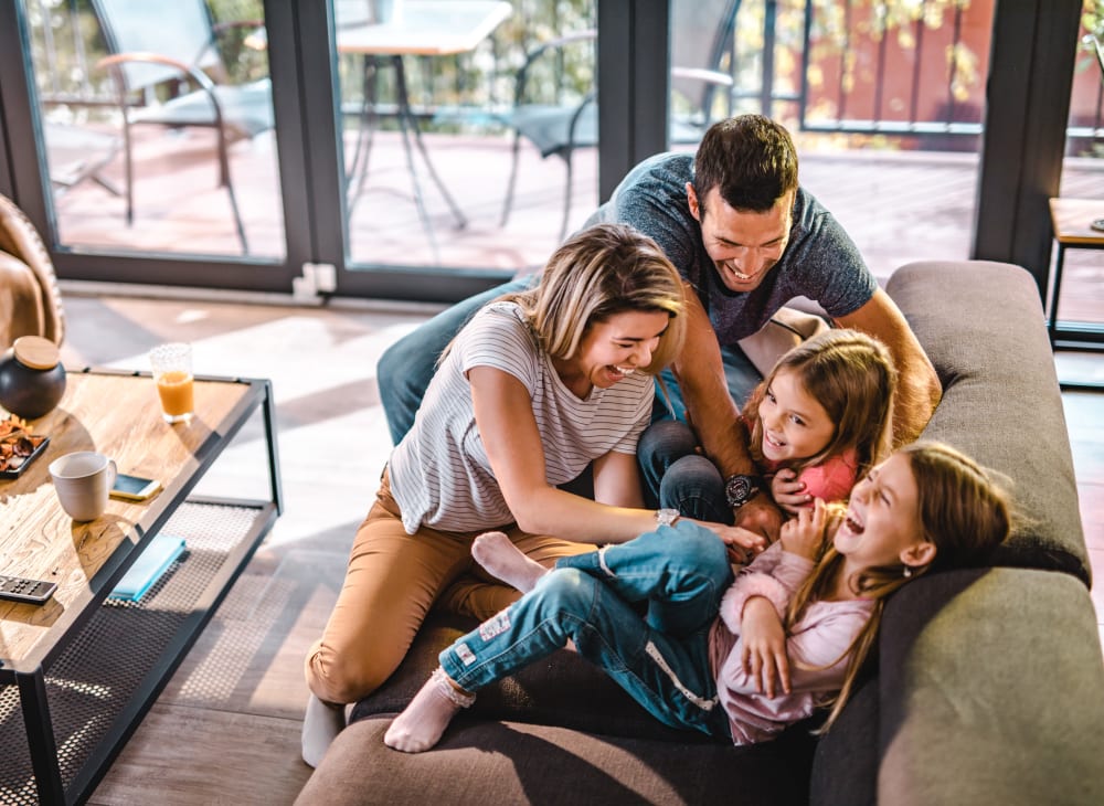 A family in their new apartment at The Columbia at the Waterfront in Vancouver, Washington
