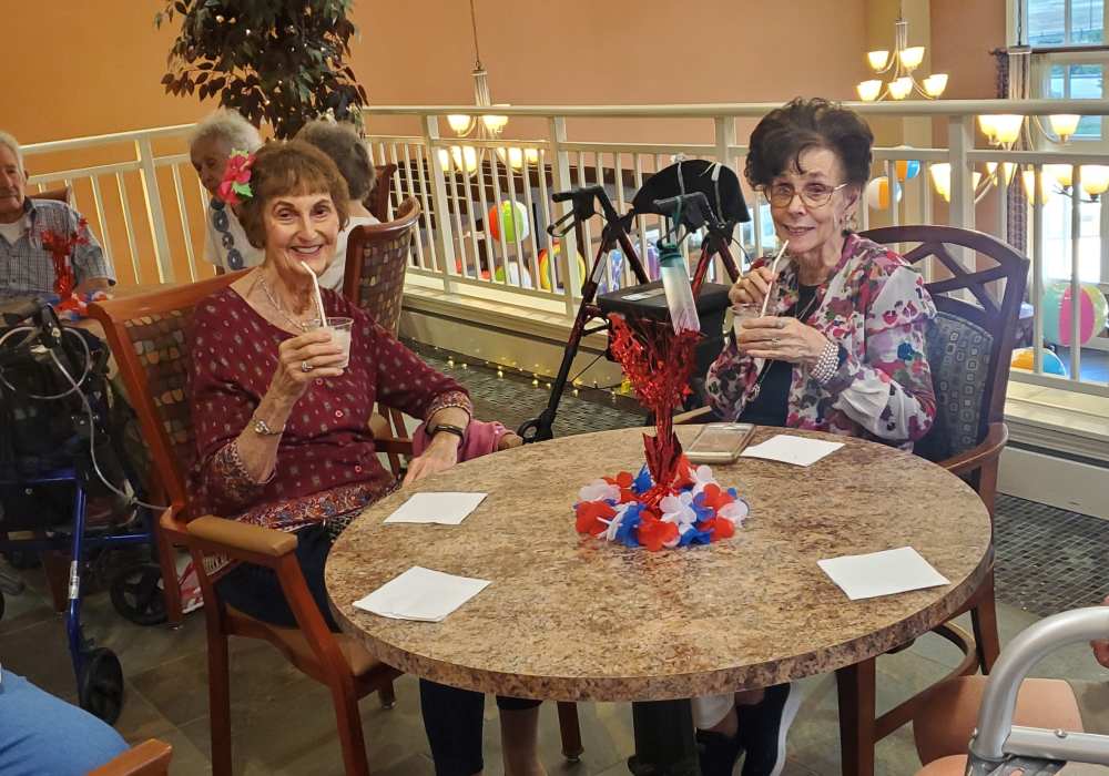 Resident friends posing at The Pines, A Merrill Gardens Community in Rocklin, California
