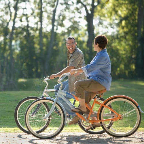 Residents enjoying a bike ride near Kingsgate Meadows Apartments in Kirkland, Washington