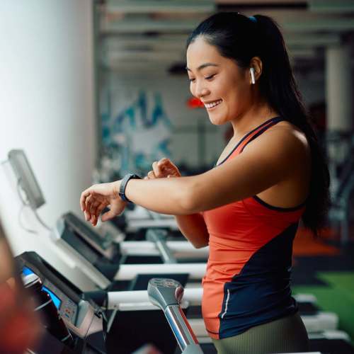 Woman facilitating the community fitness center at Park Hacienda Apartments in Pleasanton,California