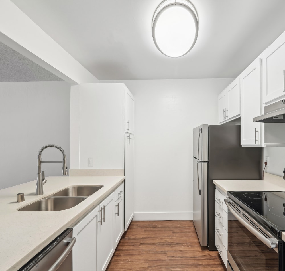 Kitchen with modern appliances at The Ralston at Belmont Hills in Belmont, California