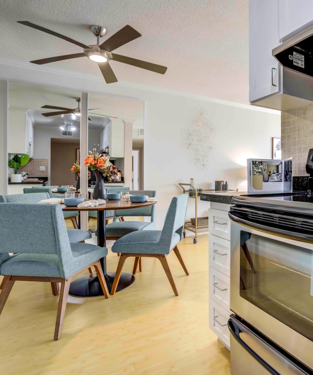 Modern kitchen with a subway tile backsplash next to the dining area of a model home at Sofi Redwood Park in Redwood City, California