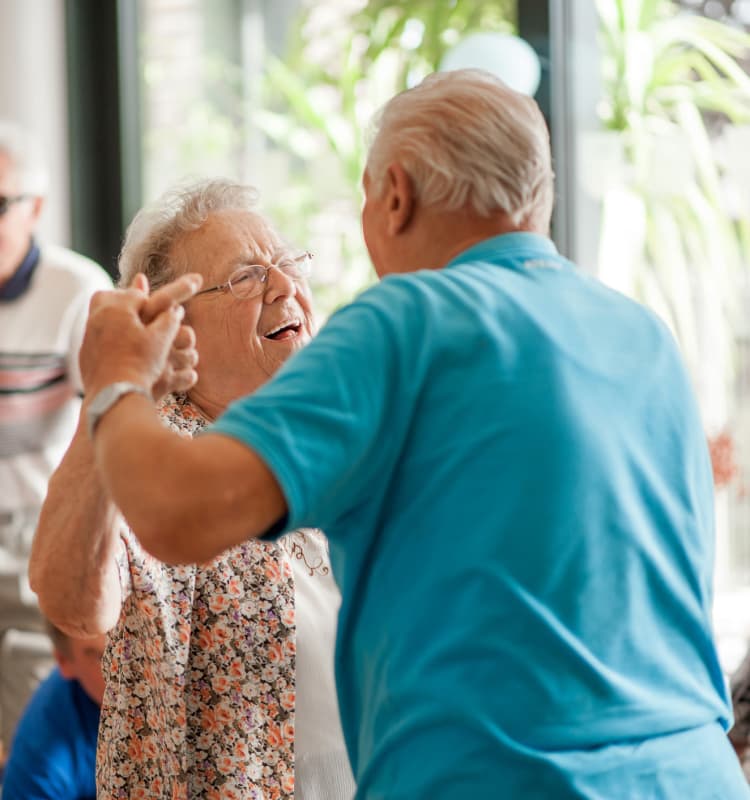 Senior couple dancing at Royalton Place