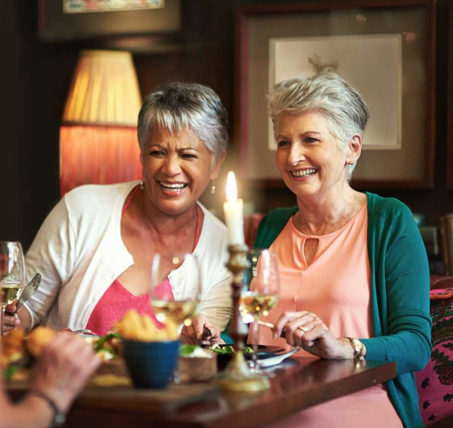 Residents enjoying snacks and drinks at a resident event at Lakeview Senior Living in Lakewood, Colorado