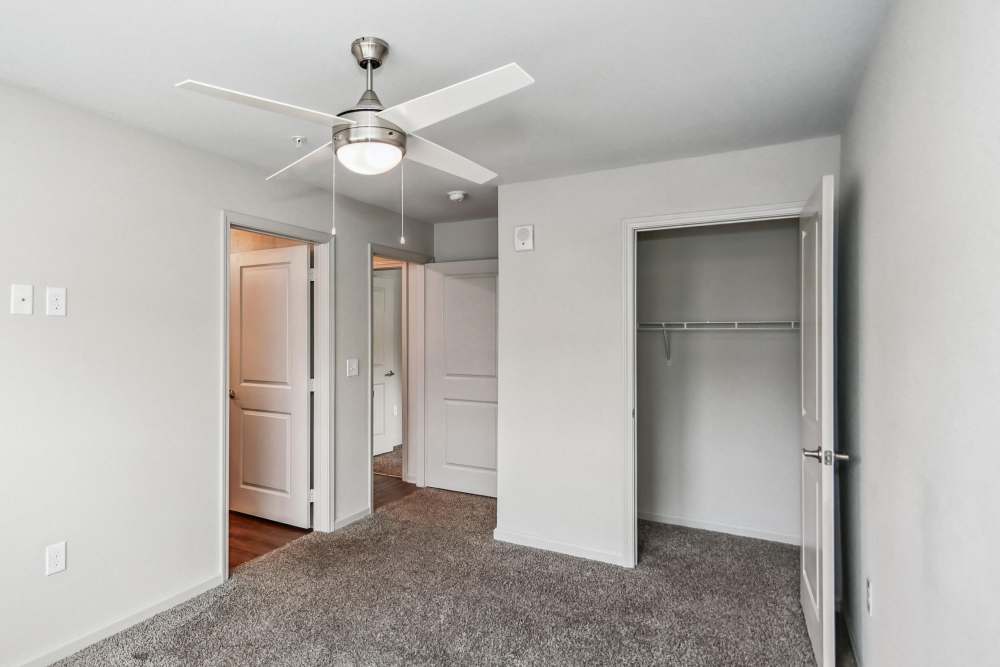 A view of a bedroom with easy access to the walk-in closet at Flats at Mount Zion in Stockbridge, Georgia