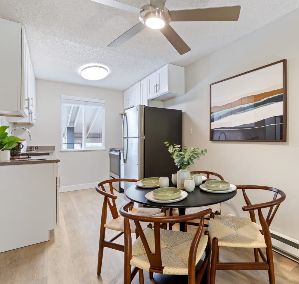 Modern open-concept kitchen in a model home at Haven Apartment Homes in Kent, Washington