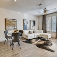 Modern furnishings in a model apartment's primary bedroom at CityView in North Kansas City, Missouri