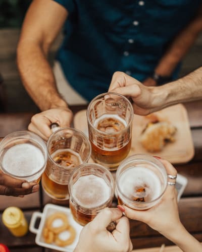 Neighbors and friends raising a toast to the good life in the resident clubhouse at 700 Broadway in Seattle, Washington