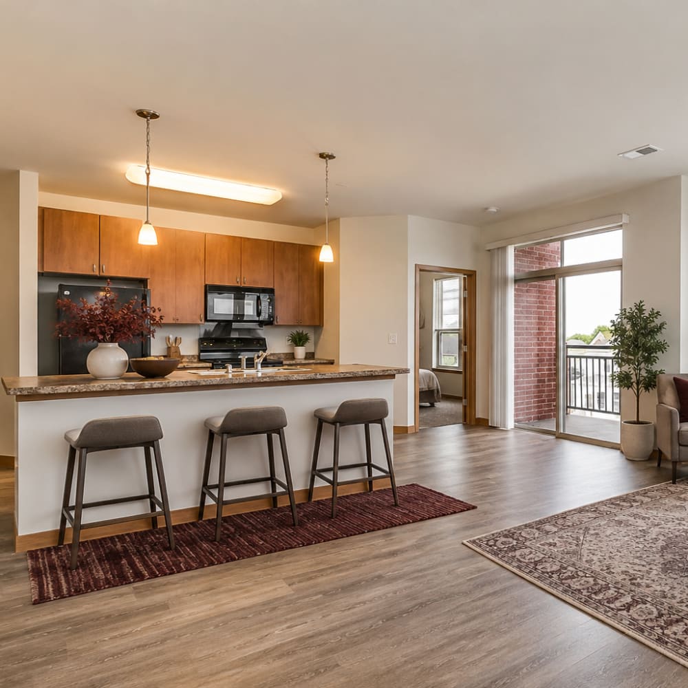 Well-lit living room and a kitchen at Cudahy, Wisconsin at Layton Square