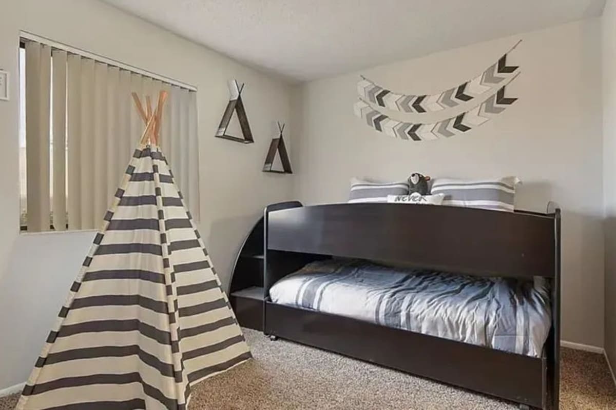 Cozy bedroom at Mesa Station Apartments in Mesa, Arizona