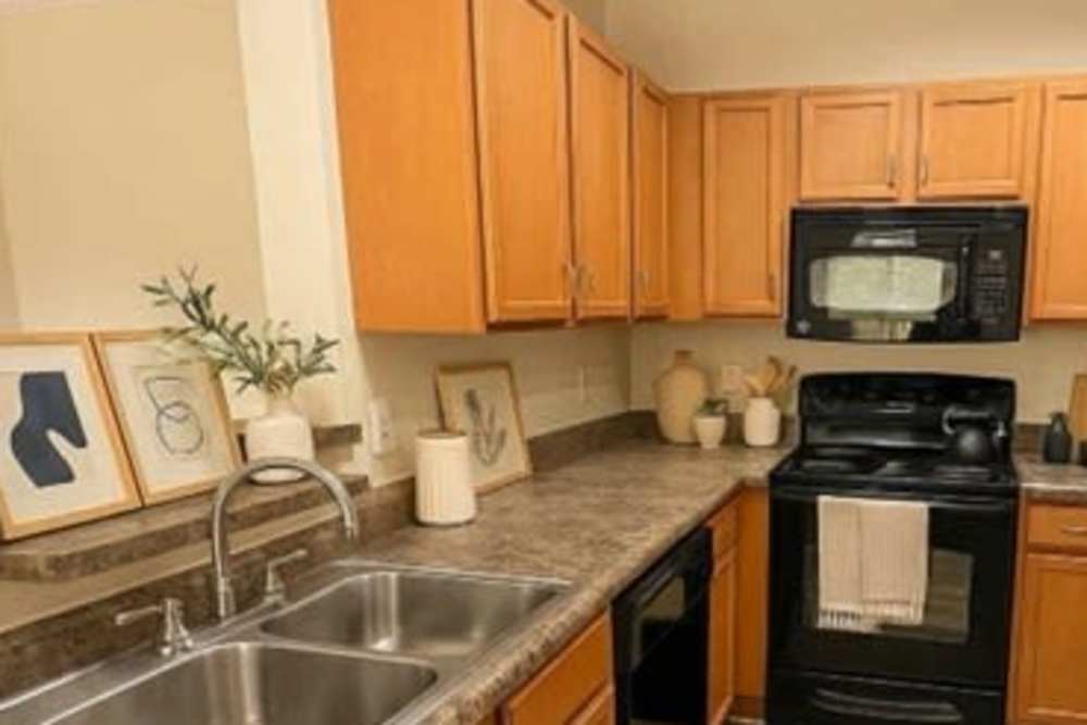 Kitchen with appliances and ample cabinet space at River Falls in Duncan, South Carolina