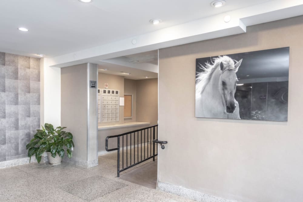 Lobby area with secure mailboxes for residents at Eastgold Long Island in Long Beach, New York