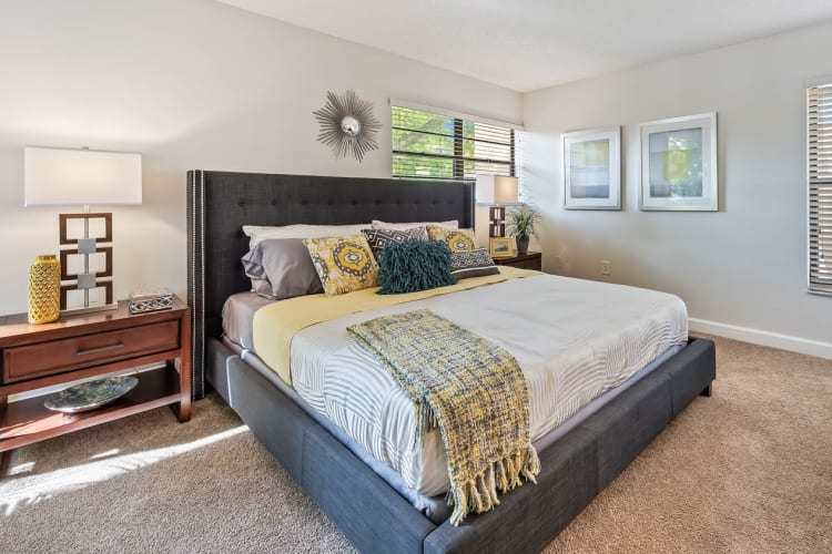 Beautiful model bedroom with plush carpeting at Meadow Walk Apartments in Miami Lakes, Florida