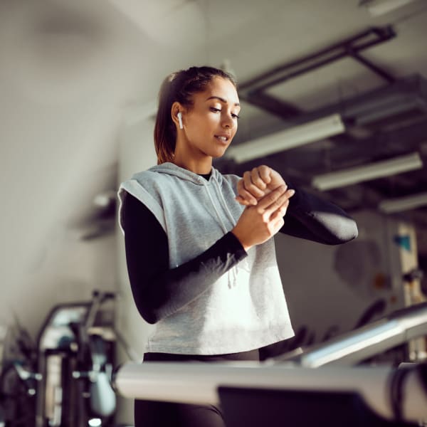 A resident works out in fitness center at Attain at Quarterpath, Williamsburg, Virginia