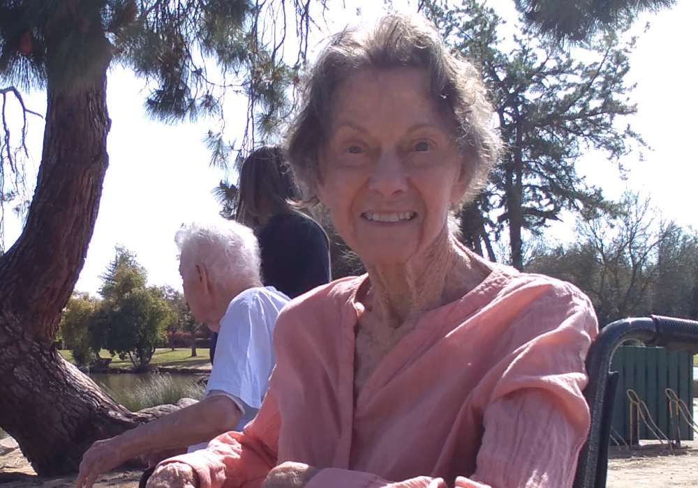 Resident enjoying a sunny day outside at a lake near Truewood by Merrill, Clovis in Clovis, California