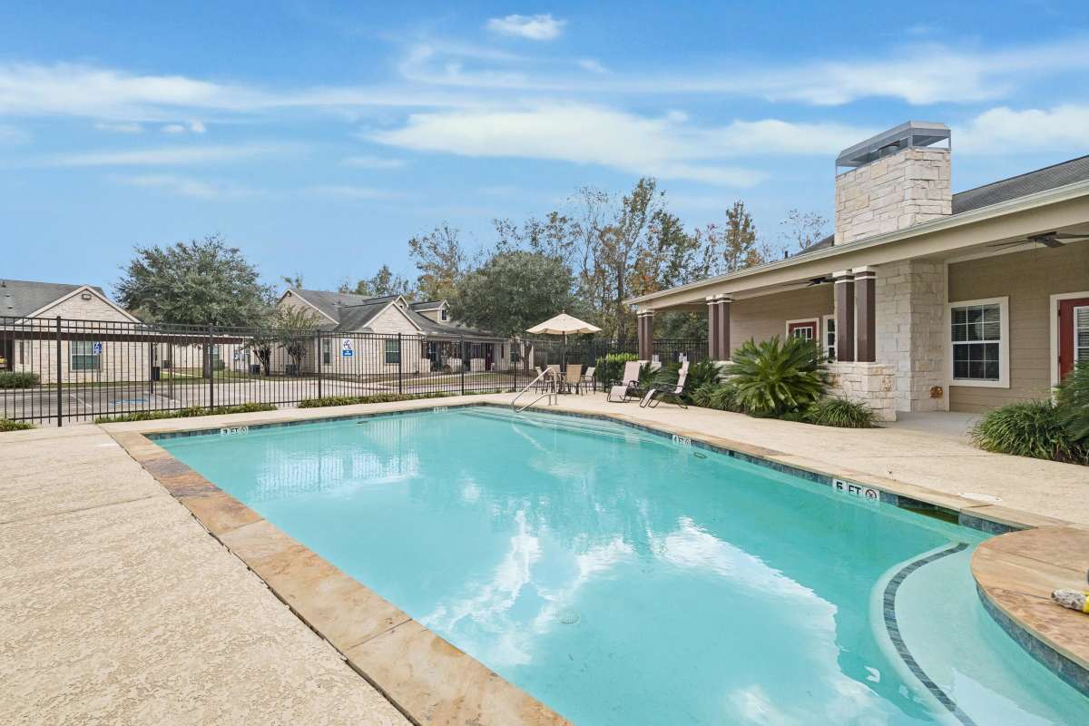 Swimming pool at Trinity Garden Apartment Homes in Liberty, Texas