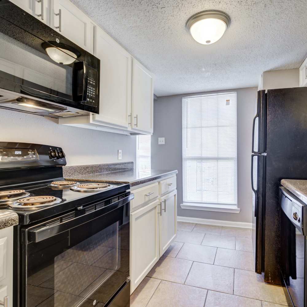 Decorative items in living area of an apartment at Westchase Apartments in Harvey, Louisiana