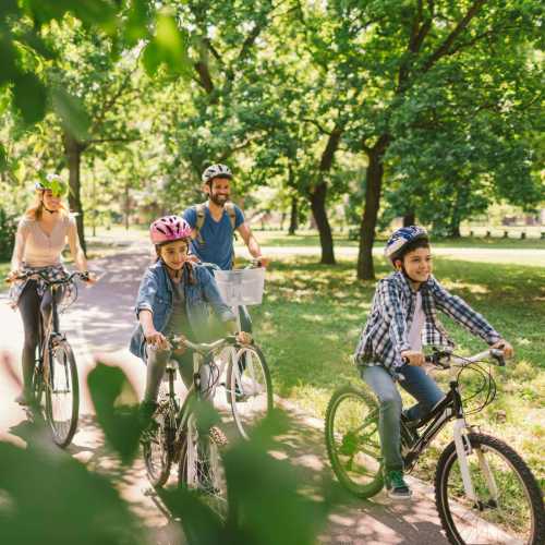 Resident family cycling in the park near Crickentree in Mt Pleasant, South Carolina,
