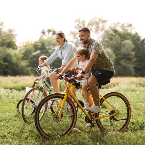 Resident family riding bicycle in the neighborhood at Valley Park Subdivision in Jackson, Mississippi