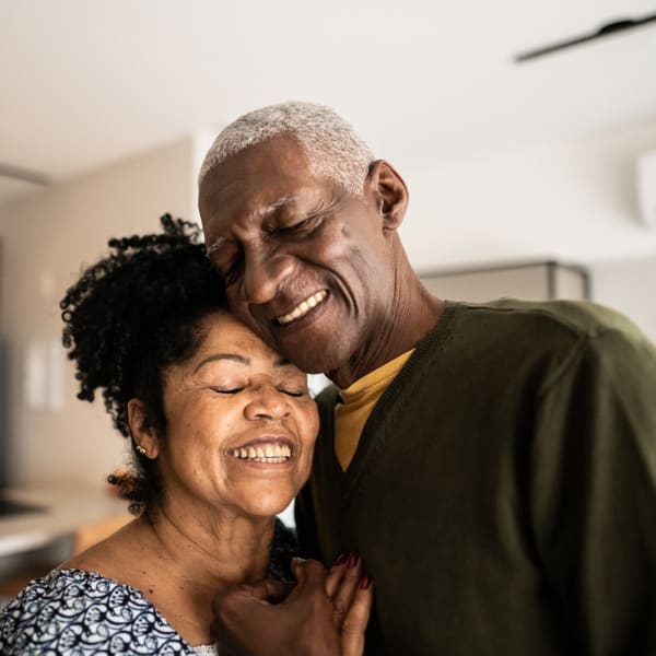 A happy couple in their apartment at Attain at Quarterpath, Williamsburg, Virginia