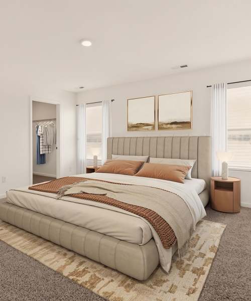 Bed with decorative pillow at Brixin Sonora in Fort Wayne, Indiana