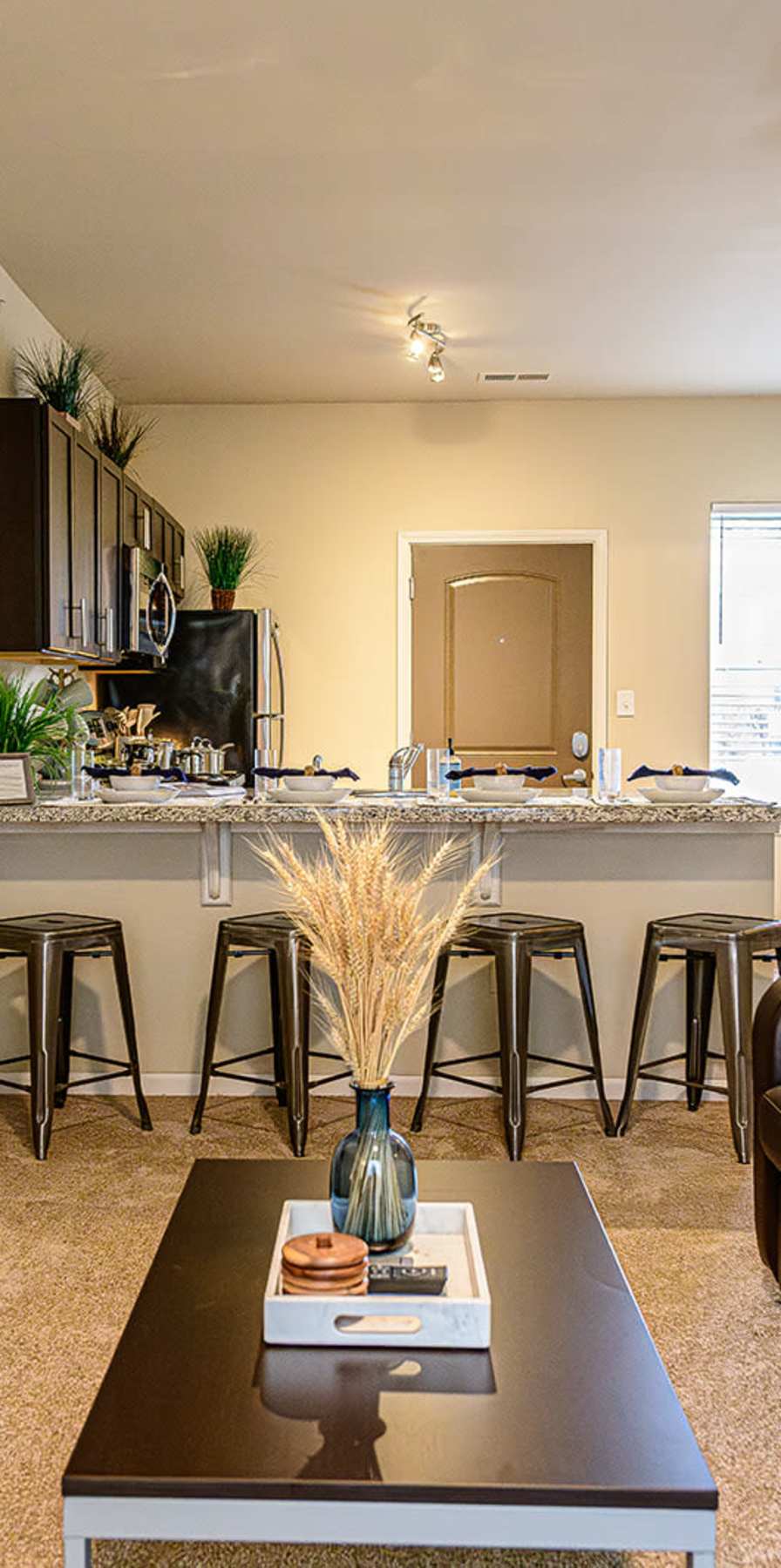 Spacious living room and kitchen at The Dillon in Bloomington, Indiana