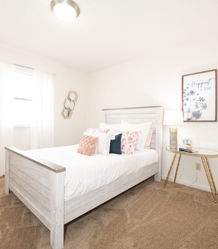 Chic bedroom with ceiling fan at The Mark Apartments in Ridgeland, Mississippi