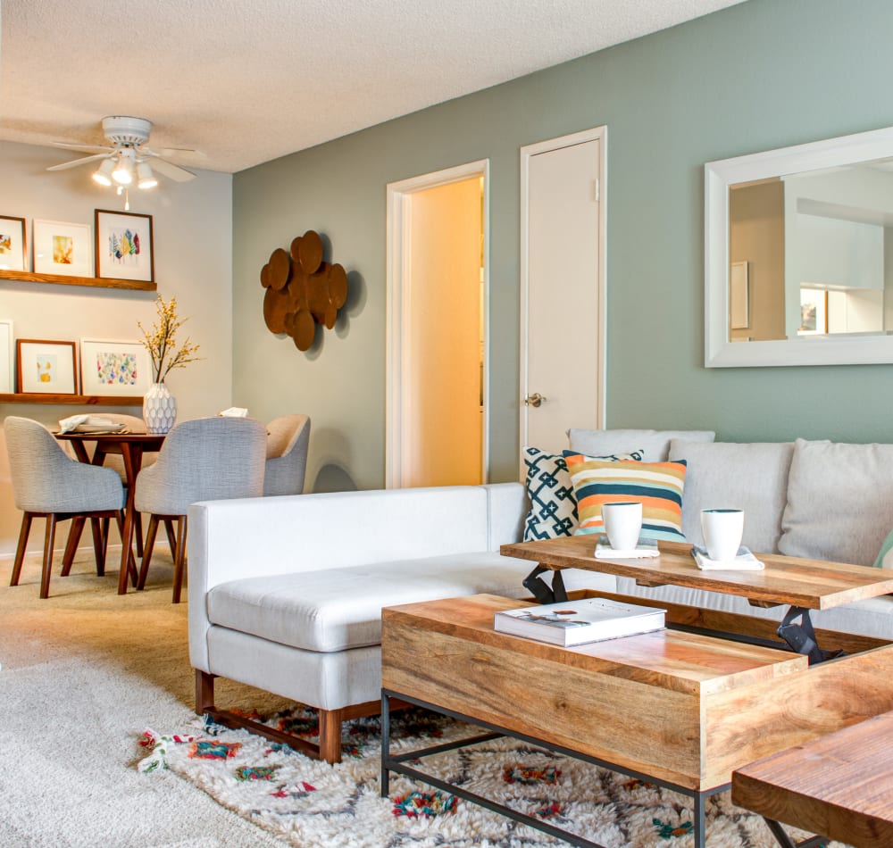 Modern furnishings and an accent wall in the living and dining areas of an open-concept model home at Sofi Dublin in Dublin, California