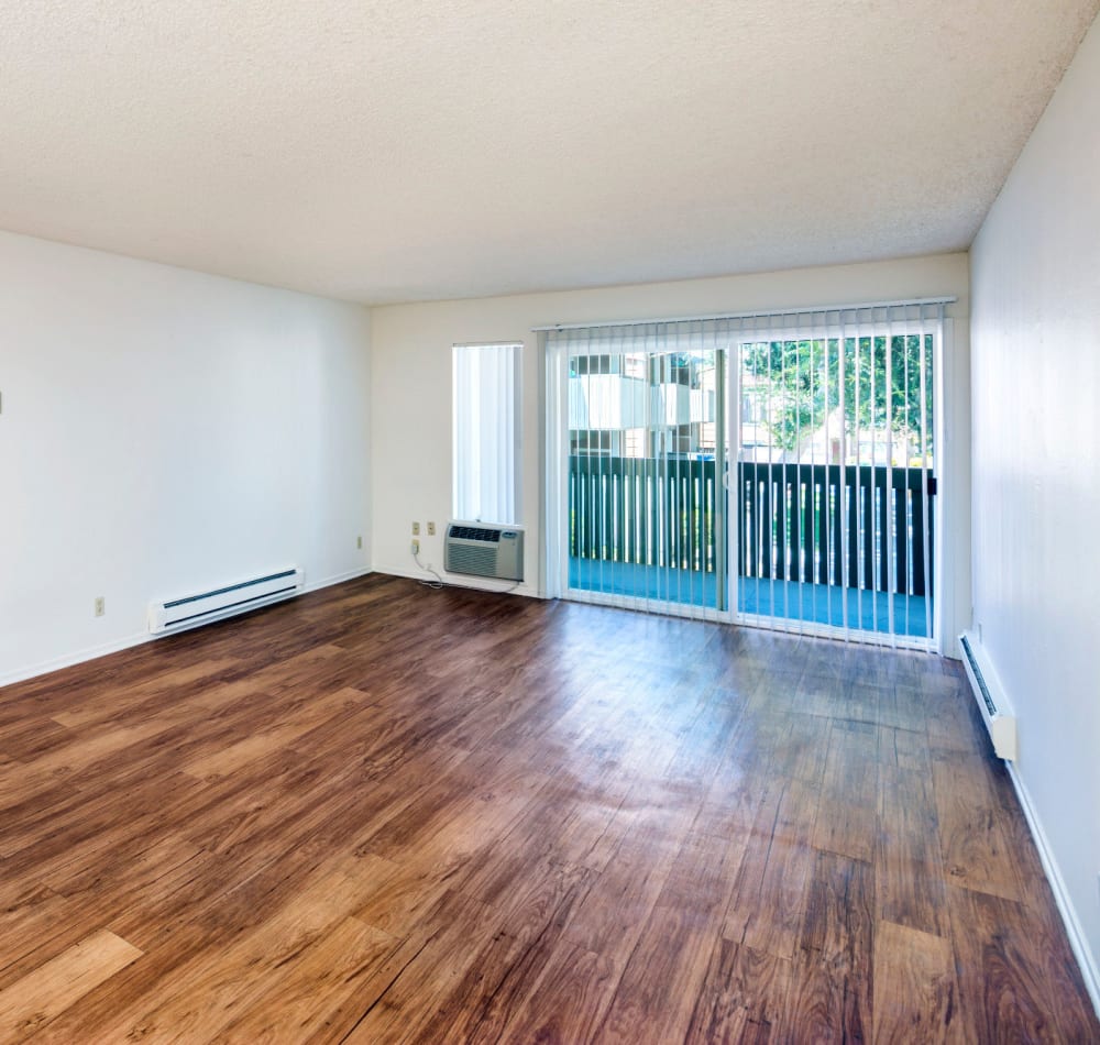 Living room area and private patio at Bidwell Park Fremont in Fremont, California