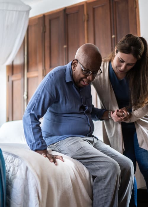 Caretaker helping a resident start their day at Liberty Arms Assisted Living in Youngstown, Ohio