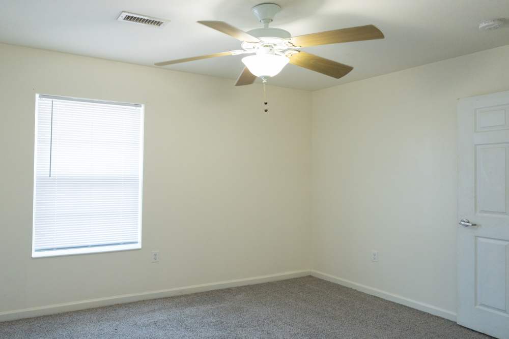 Bedroom with a ceiling fan at Fairway Breeze in El Reno. OK