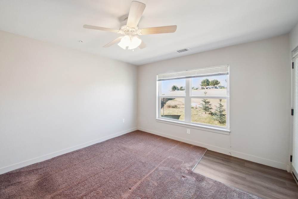 Bedroom with window at Villas At Mesa Ridge in Fountain,Colorado