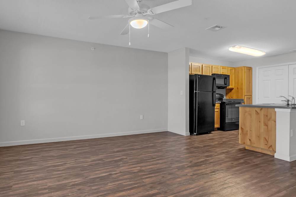 Living room with access to kitchen at Whittier Heights in Tulsa. OK