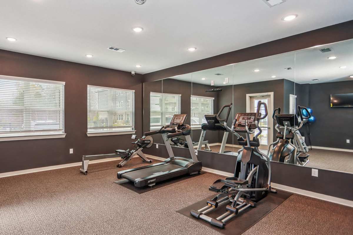 Residents working out in the fitness center at Flats at Mount Zion in Stockbridge, Georgia