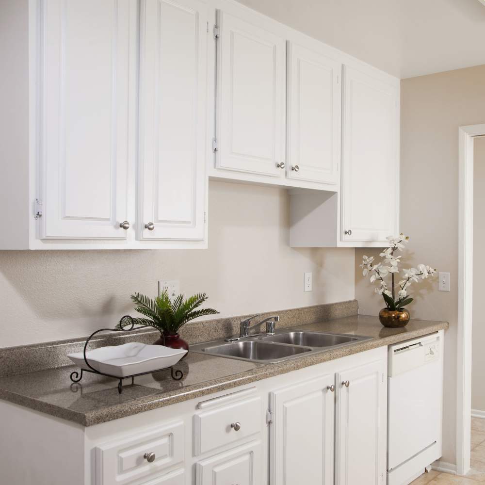 Kitchen with white appliances at Forest Glen in Lake Forest,California