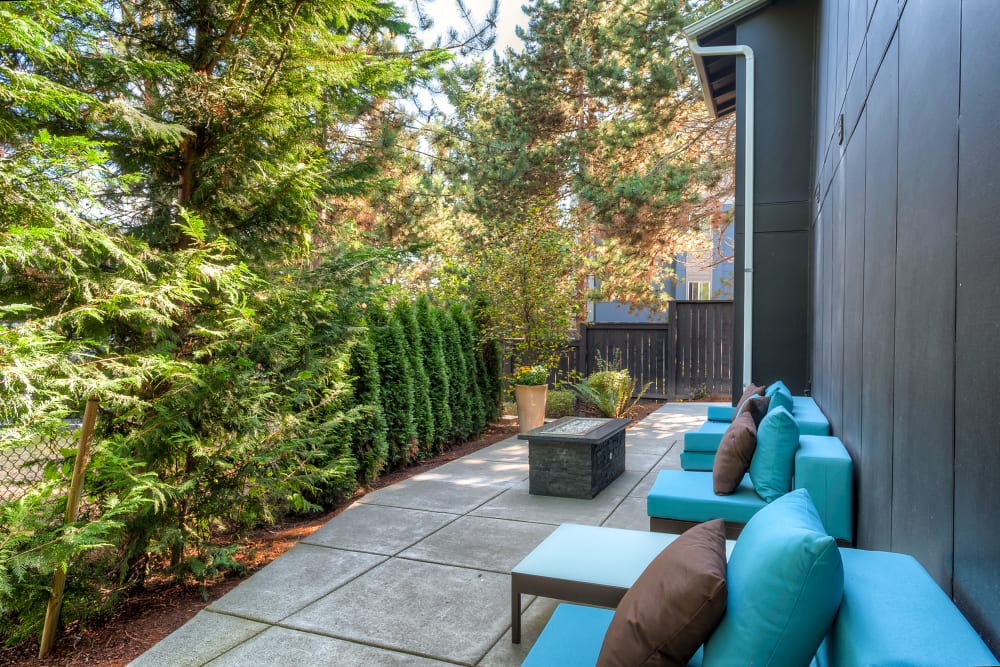 Fire pit lounge area at Karbon Apartments in Newcastle, Washington