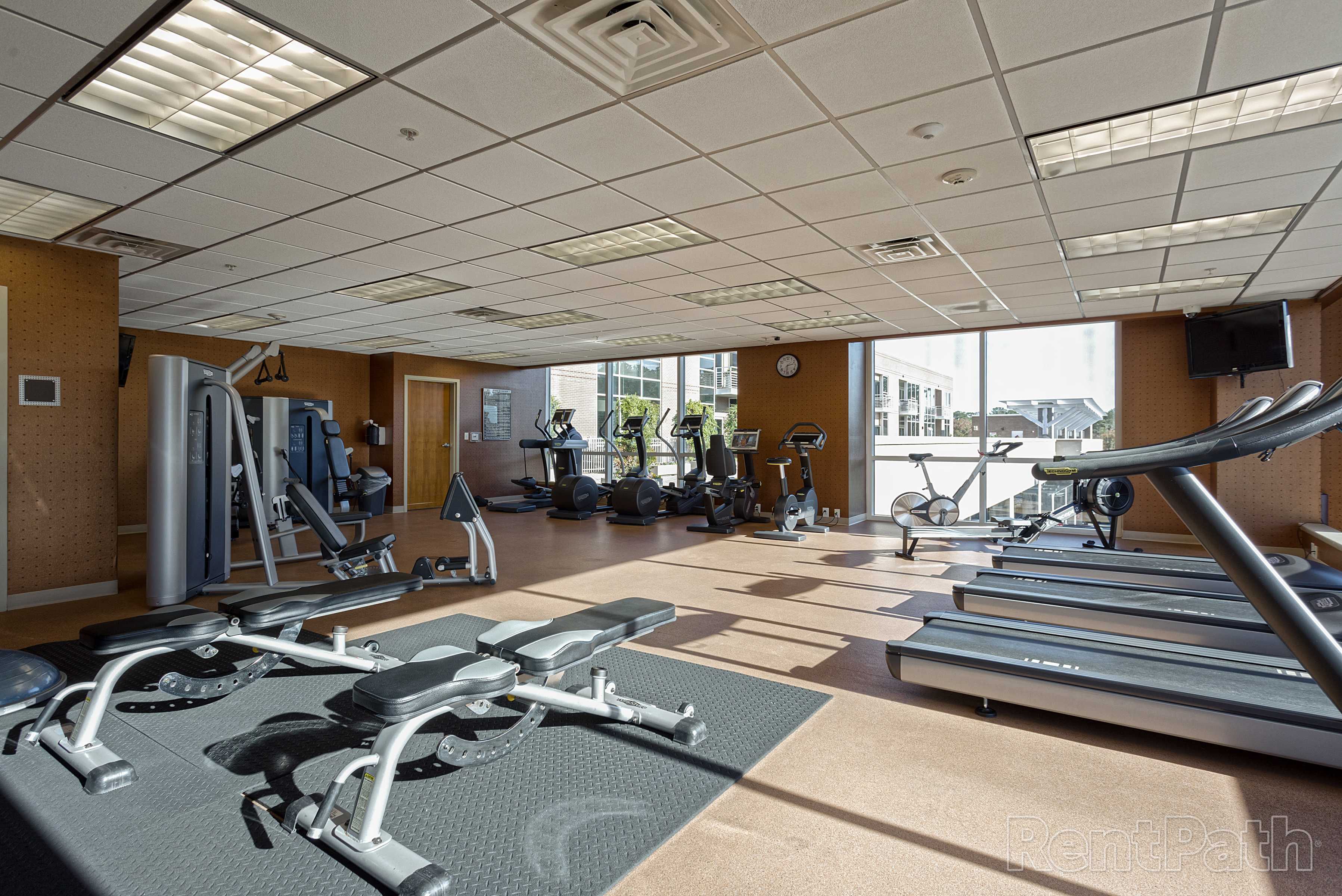 Weightlifting equipment in the fitness center at Environs Lofts at East 54 in Chapel Hill, North Carolina