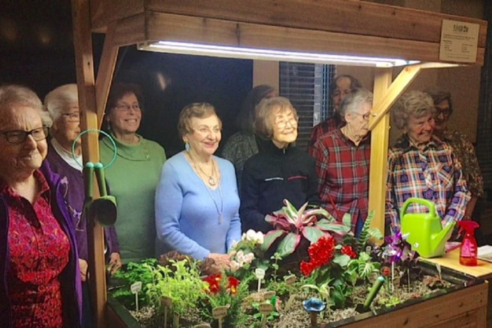 Residents gardening at Merrill Gardens at Madison in Madison, Alabama. 