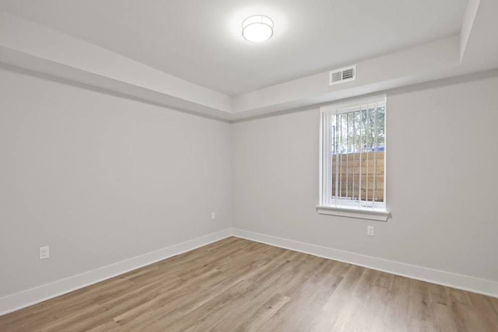 Well-lit spacious bedroom layout at Colonnade At The Creek in Takoma Park, Maryland